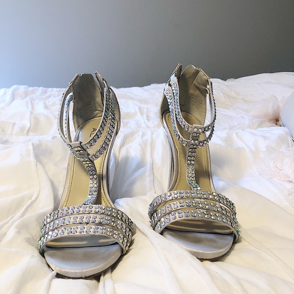 Also silver high heel shoes